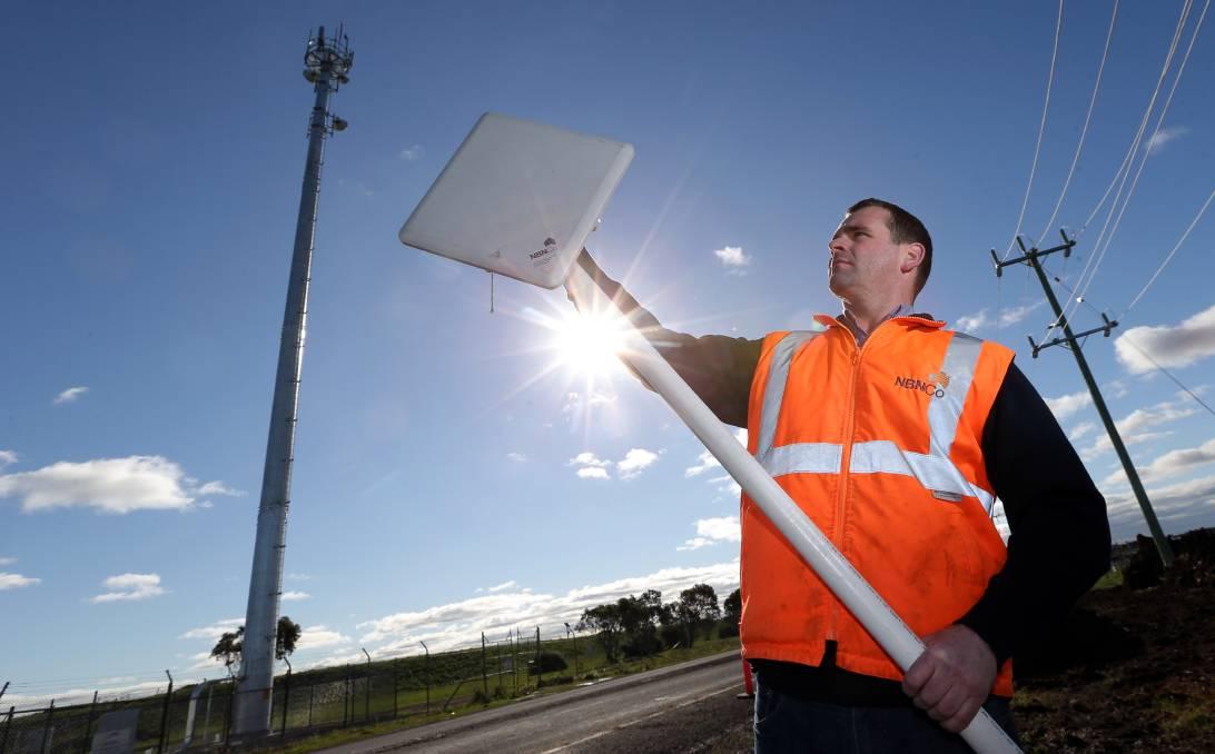 nbn<sup>®</sup> technician setting up a fixed wireless connection